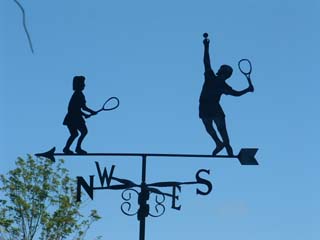 Two tennis players weather vane